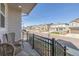 Welcoming front porch with views of a quiet street lined with similar homes at 11400 W Grand Ave, Littleton, CO 80127