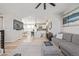 Open-concept living space with seamless flow to the kitchen and dining area, perfect for entertaining at 11400 W Grand Ave, Littleton, CO 80127