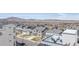 An aerial view of a modern, planned neighborhood with a mountain backdrop at 11400 W Grand Ave, Littleton, CO 80127