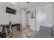 Bright office space featuring a sofa, desk, and a TV at 11400 W Grand Ave, Littleton, CO 80127