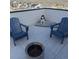 Rooftop deck features comfortable blue chairs and a fire pit with scenic views at 11400 W Grand Ave, Littleton, CO 80127