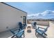Enjoy the sun on this rooftop patio with Adirondack chairs and a fire pit at 11400 W Grand Ave, Littleton, CO 80127