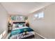 Bright bedroom with a comfy bed and plenty of natural light at 2222 Fenton St, Edgewater, CO 80214