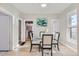 Elegant dining area with a glass table and four chairs at 2222 Fenton St, Edgewater, CO 80214