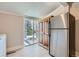 Laundry room with sliding door to backyard at 2222 Fenton St, Edgewater, CO 80214