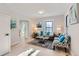 Bright and airy living room with light flooring and teal accents at 2222 Fenton St, Edgewater, CO 80214