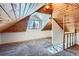 Spacious loft bedroom with wood ceilings and carpet flooring at 2222 Fenton St, Edgewater, CO 80214