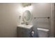 Grey vanity and updated bathroom fixtures at 5341 Granby St, Denver, CO 80239