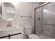 Modern bathroom with white vanity, marble shower, and updated fixtures at 5341 Granby St, Denver, CO 80239