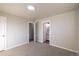 Bedroom with grey carpet and access to a hallway bathroom at 5341 Granby St, Denver, CO 80239