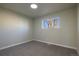 Bright, carpeted bedroom with a window providing natural light at 5341 Granby St, Denver, CO 80239