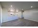 Open concept living room and kitchen with luxury vinyl plank flooring at 5341 Granby St, Denver, CO 80239