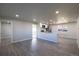 Open concept living room and kitchen with luxury vinyl plank flooring at 5341 Granby St, Denver, CO 80239