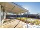 Covered patio with seating and a view of the fenced backyard at 5341 Granby St, Denver, CO 80239