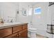 Well-lit bathroom with bathtub, toilet and vanity at 2946 Central Park Blvd, Denver, CO 80238