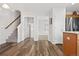 Entryway with stairs, hardwood floors and views to kitchen and living room at 2946 Central Park Blvd, Denver, CO 80238