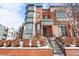 Front view of a three-story brick townhome at 2946 Central Park Blvd, Denver, CO 80238