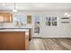 Kitchen with island, hardwood floors and access to backyard patio at 2946 Central Park Blvd, Denver, CO 80238