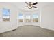 Main bedroom with bay window, carpet and ceiling fan at 2946 Central Park Blvd, Denver, CO 80238