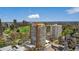 Stunning aerial view of the high-rise apartment building nestled amidst lush greenery and a vibrant cityscape at 1250 N Humboldt St # 1504, Denver, CO 80218