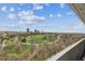 Expansive views from the balcony overlooking lush parkland and the distant city skyline at 1250 N Humboldt St # 1504, Denver, CO 80218