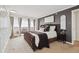 Main bedroom offers neutral carpet, ample natural light, and a door to the outdoor patio at 1250 N Humboldt St # 1504, Denver, CO 80218
