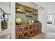Stylish hallway featuring built-in shelves, unique decor, and seamless access to the living area and balcony at 1250 N Humboldt St # 1504, Denver, CO 80218