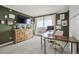 Comfortable home office with a large desk and a view of the city from a private balcony at 1250 N Humboldt St # 1504, Denver, CO 80218
