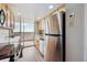 Updated kitchen features stainless steel appliances, bright countertops, and a slider to the outdoor balcony at 1250 N Humboldt St # 1504, Denver, CO 80218