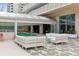 Stylish outdoor patio with comfortable seating and access to a bright indoor pool at 1250 N Humboldt St # 1504, Denver, CO 80218