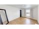 Well-lit bedroom featuring hardwood floors at 43620 E 80Th Ave, Bennett, CO 80102