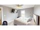 Bedroom with a queen bed and large TV at 43620 E 80Th Ave, Bennett, CO 80102