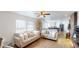 Living room with beige sofas and view into kitchen at 43620 E 80Th Ave, Bennett, CO 80102