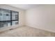 Bright bedroom with neutral carpet, window, and natural light at 2066 S Holly St # 3, Denver, CO 80222