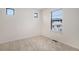 Cozy bedroom with plush carpet and bright windows at 2066 S Holly St # 3, Denver, CO 80222