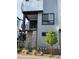 Stylish townhome with a private balcony, stone accents, and contemporary design at 2066 S Holly St # 3, Denver, CO 80222