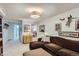 A modern living room features a brown sectional sofa and unique decor at 3975 S Logan St, Englewood, CO 80113