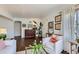 Inviting living room with hardwood floors, white walls, and cozy seating area at 3975 S Logan St, Englewood, CO 80113