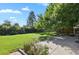 Spacious backyard with patio and mature trees at 6642 S Bridger Ct, Centennial, CO 80121