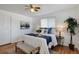 Bright bedroom with hardwood floors and ceiling fan at 6642 S Bridger Ct, Centennial, CO 80121