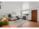 Living area with hardwood floors, a neutral color palette, and ample natural light at 6642 S Bridger Ct, Centennial, CO 80121