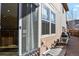 Back patio with large sliding glass door and room for grilling and patio furniture at 7976 E 53Rd Dr, Denver, CO 80238