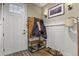 Functional entryway with coat rack, shoe storage, and stylish decor at 7976 E 53Rd Dr, Denver, CO 80238