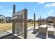 Community Harvest Park with seating and view of neighborhood homes at 7976 E 53Rd Dr, Denver, CO 80238