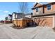 Exterior elevation view showing the driveway, garage and front street at 7976 E 53Rd Dr, Denver, CO 80238
