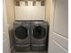 Convenient laundry room equipped with modern washer and dryer at 7976 E 53Rd Dr, Denver, CO 80238