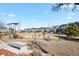 Community playground area with swings, slide, and green space for outdoor recreation and Gathering fun at 7976 E 53Rd Dr, Denver, CO 80238