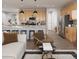 Stylish kitchen boasting a center island, stainless steel appliances, and modern pendant lighting fixtures at 17055 W 92Nd Loop, Arvada, CO 80007
