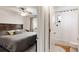 This is a primary bedroom with a king bed and an adjacent bathroom at 529 N Washington St # 304, Denver, CO 80203