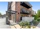 Charming brick apartment building featuring inviting balconies and a secure gated entrance at 529 N Washington St # 304, Denver, CO 80203